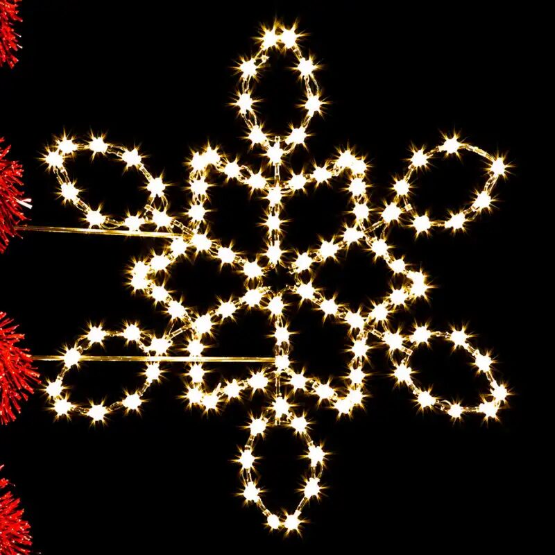 Glowing snowflake holiday lights against black background