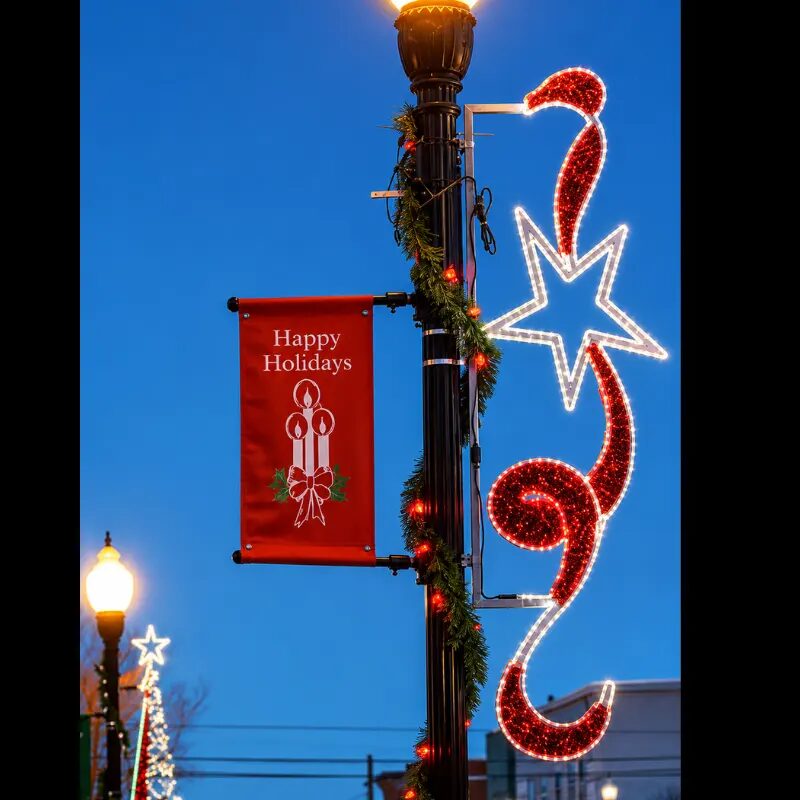Holiday streetlight with festive banner and star lights