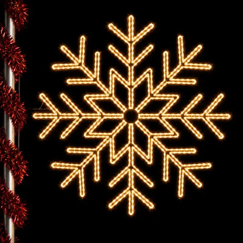 Glowing snowflake light decoration against dark background