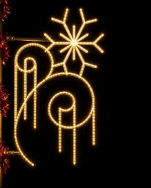 Glowing holiday snowflake and ornament street decoration