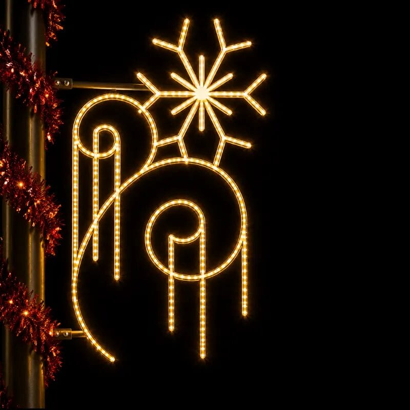 Glowing holiday snowflake and ornament street decoration