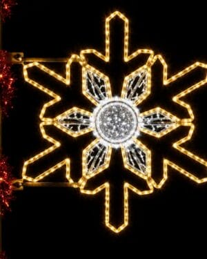 Illuminated snowflake holiday light decoration at night