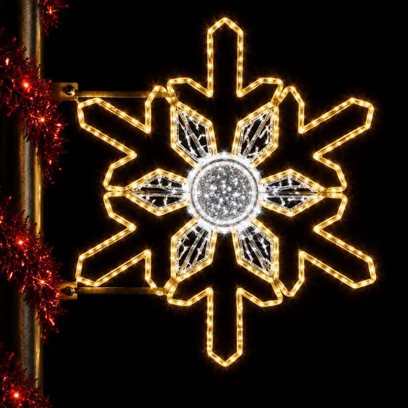 Illuminated snowflake holiday light decoration at night