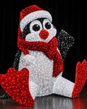 Christmas penguin light display with red scarf and hat