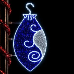 Illuminated blue Christmas ornament commercial pole mount light display at night