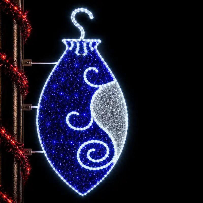 Illuminated blue Christmas ornament street decoration at night