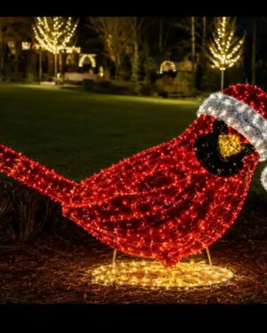 Illuminated red cardinal commercial Christmas decor wearing Santa hat