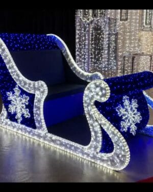 Illuminated blue and white commercial Christmas sleigh decor