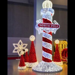 Illuminated North Pole Christmas display with candy cane pole commercial Christmas dimensional display
