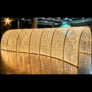 Illuminated tunnel of warm white string large scale Christmas decorations