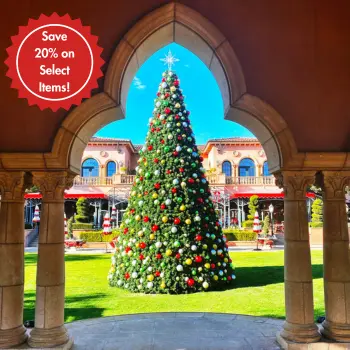 Decorated Christmas tree framed by ornate stone archway